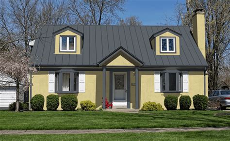 yellow house gray metal roof|yellow house with gray roof.